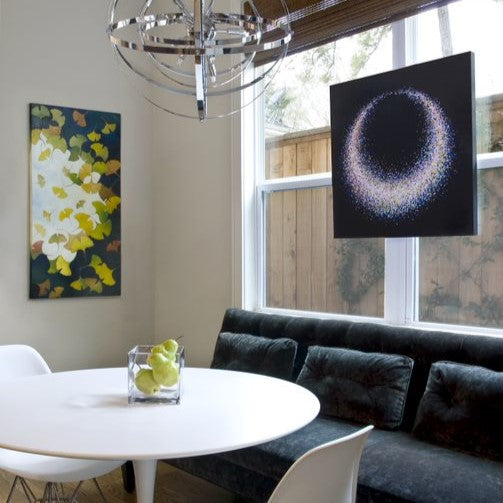 “Gingko Leaves Against the Sky” by Hellenne Vermillion (on wall) and “Almost” by UGallery artist Tomo Mori (on window)