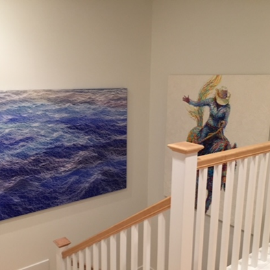 A recent UGallery client selected art entitled “Rodeo” by artist Iris Scott to decorate a stairwell