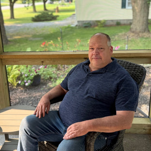 UGallery artist David Thelen sitting on a porch