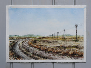 Tractor Tracks on the Road by Erika Fabokne Kocsi |  Side View of Artwork 