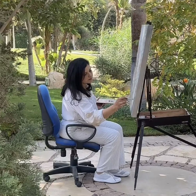  UGallery artist Dowa Hattem painting in her garden 