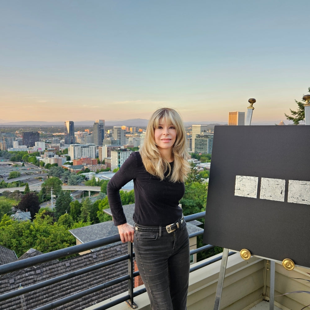  UGallery artist Leslie Ann Butler standing on the deck of her Portland home 