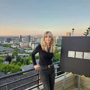  UGallery artist Leslie Ann Butler standing on the deck of her Portland home 