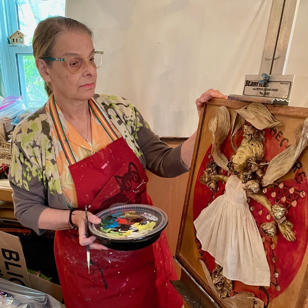  UGallery artist Libby Ramage adding details to her collage 