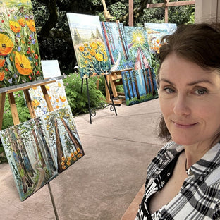  UGallery artist Lisa Elley with some of her impressionist paintings 