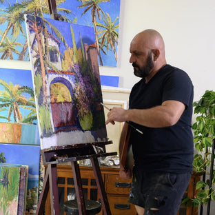  UGallery artist Suren Nersisyan painting at his easel 