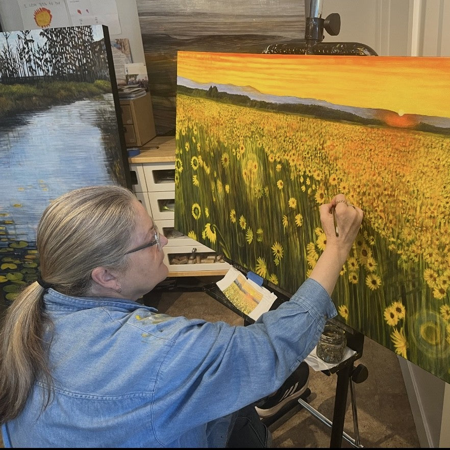  UGallery artist Theresa Andreas-O'Leary painting a sunflower field 