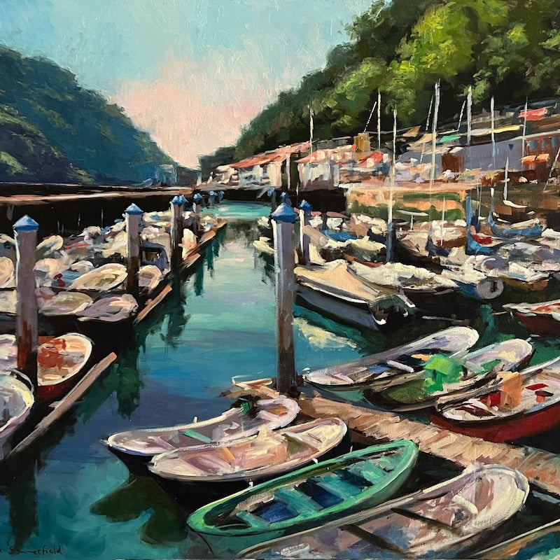  An impressionist painting by artist Jonelle Summerfield of boats along a dock in San Sebastian, Spain 